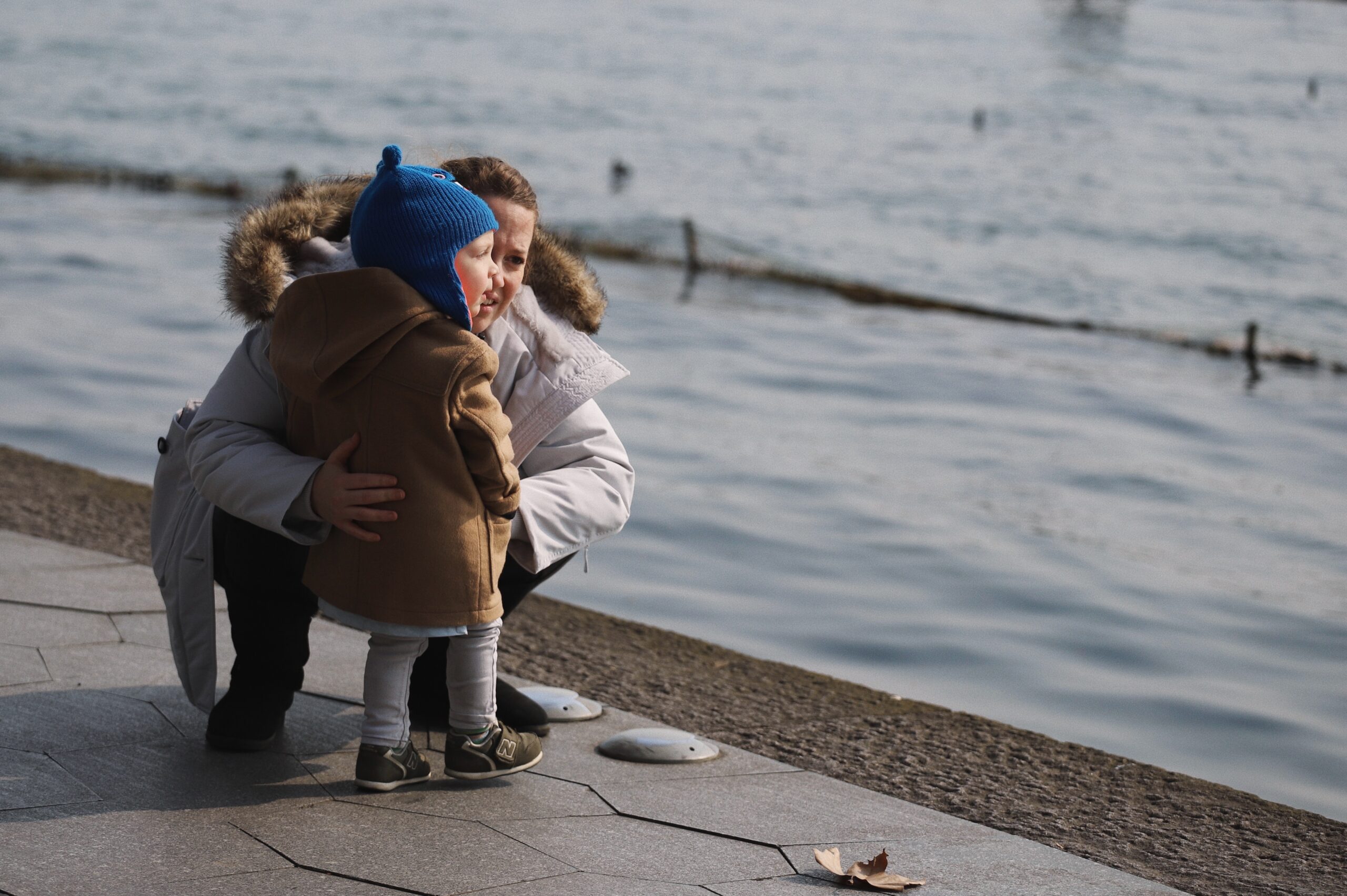 Mother and child by the water